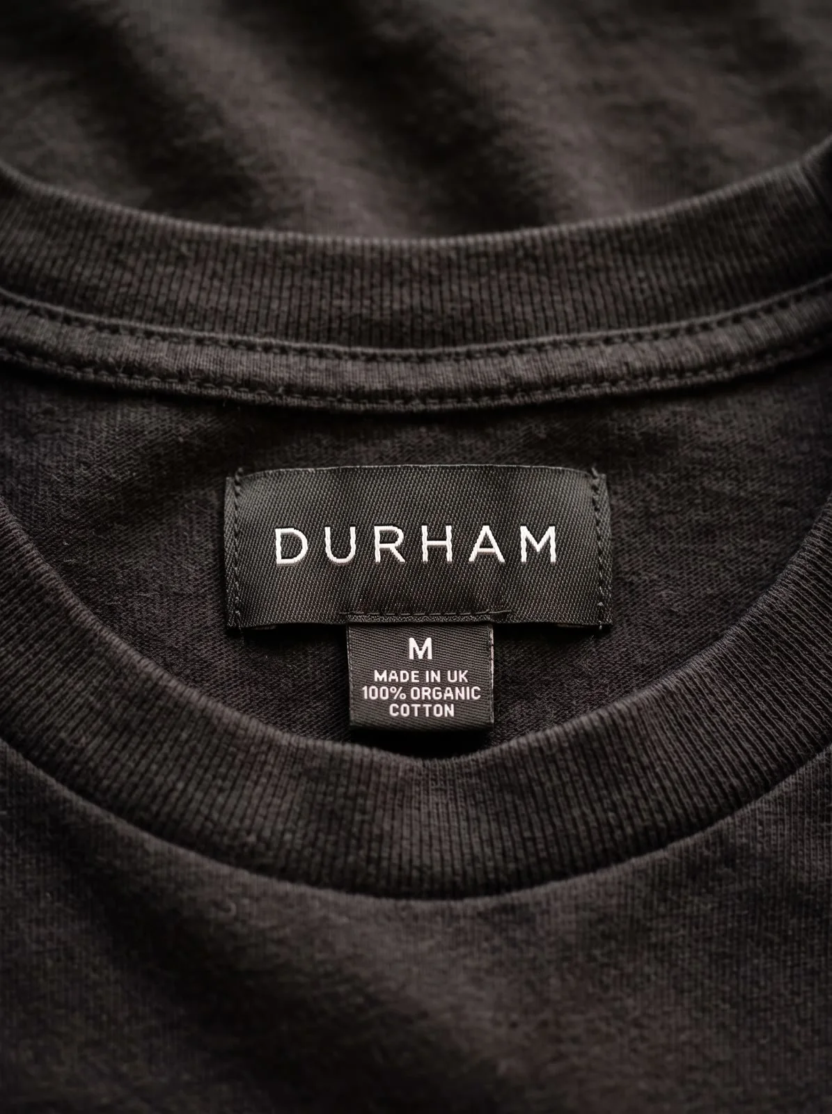 DURHAM woven neck label close-up